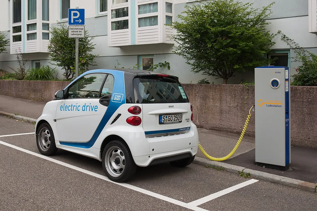 EnBW electric car charging station in Stuttgart with a 3rd generation Smart electric car of carsharing company Car2Go
