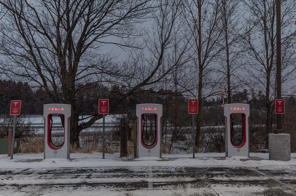 A Tesla at a Supercharger